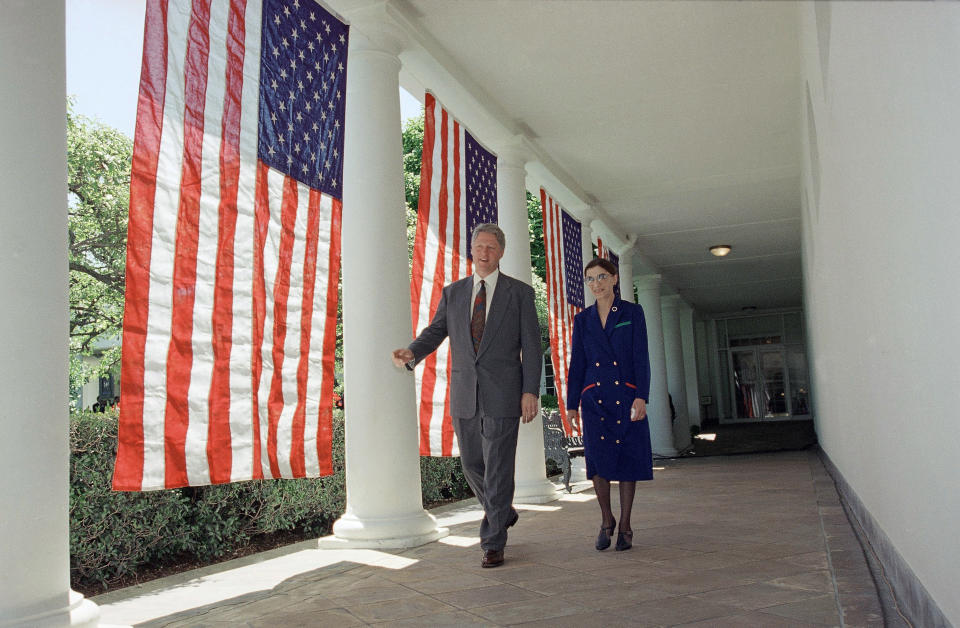 FILE - In this June 14, 1993, file photo, President Bill Clinton and Judge Ruth Bader Ginsburg walk along the Colonnade of the White House in Washington, as they head to the Rose Garden for a news conference where the President nominated Ginsburg to fill the vacancy on the Supreme Court. The Supreme Court says Ginsburg has died of metastatic pancreatic cancer at age 87. (AP Photo/Doug Mills, File)