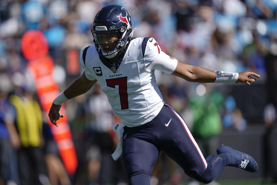 Houston Texans quarterback C.J. Stroud (7) runs against the Carolina Panthers during the first half of an NFL football game, Sunday, Oct. 29, 2023, in Charlotte, N.C. (AP Photo/Erik Verduzco)
