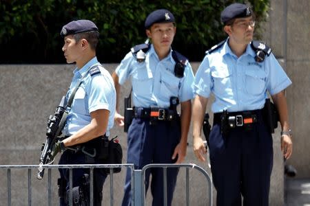 Armed policemen secure the area around the hotel where Chinese President Xi Jinping is about to arrive, in Hong Kong, China June 29, 2017. REUTERS/Damir Sagolj