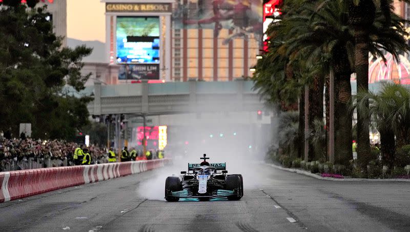 Mercedes’ George Russell drives during a demonstration along the Las Vegas Strip at a launch party for the Formula One Las Vegas Grand Prix on Saturday, Nov. 5, 2022, in Las Vegas.