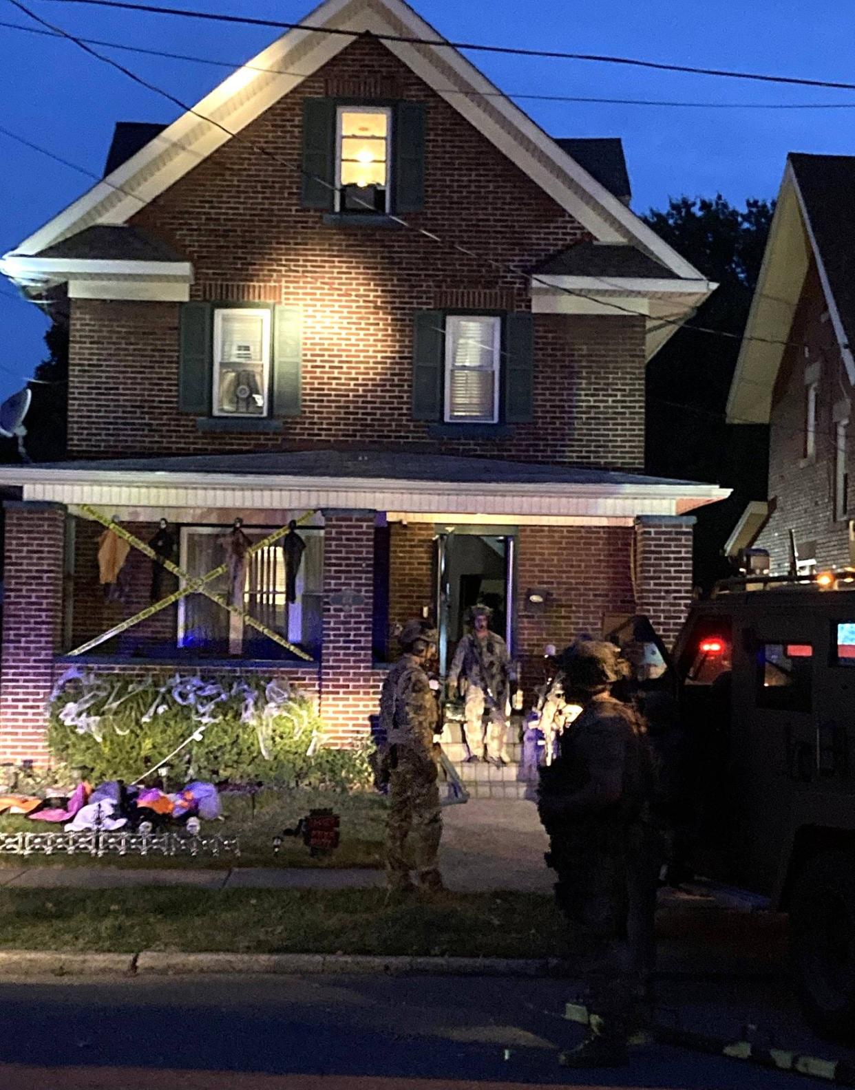 The FBI and police raid a house in the 400 block of West 31st Street in Erie on Wednesday morning as part of a drug sweep in a large-scale federal case.