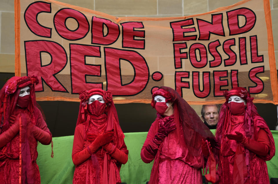 Extension Rebellion activists take part in a demonstration against 'Greenwashing' (an attempt to make people believe that your company or government is doing more to protect the environment than it really is) near the COP26 U.N. Climate Summit in Glasgow, Scotland, Wednesday, Nov. 3, 2021. The U.N. climate summit in Glasgow gathers leaders from around the world, in Scotland's biggest city, to lay out their vision for addressing the common challenge of global warming. (AP Photo/Alastair Grant)