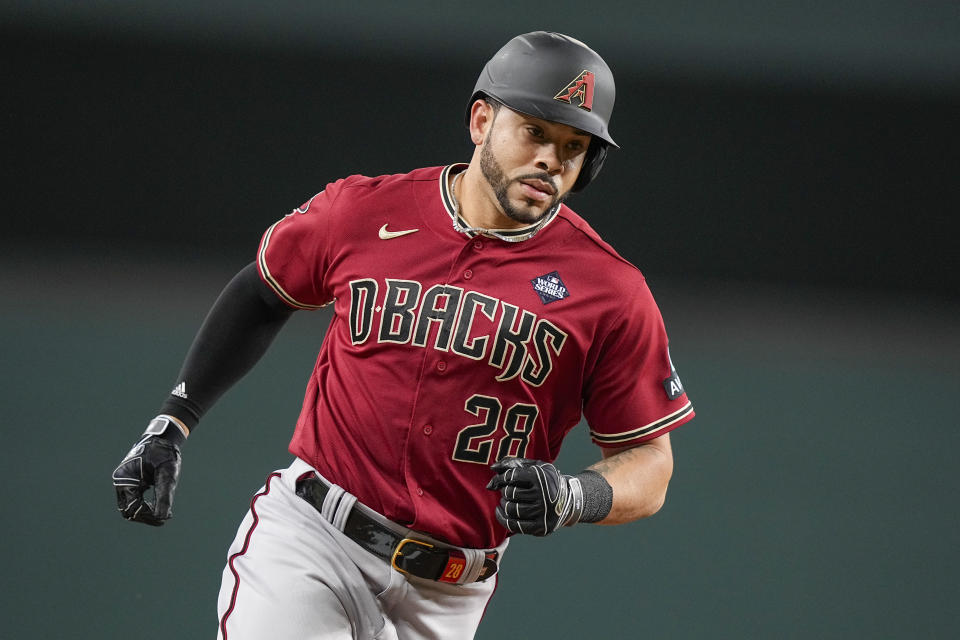Arizona Diamondbacks' Tommy Pham rounds the bases after a home run against the Texas Rangers during the fourth inning in Game 1 of the baseball World Series Friday, Oct. 27, 2023, in Arlington, Texas. (AP Photo/Brynn Anderson)