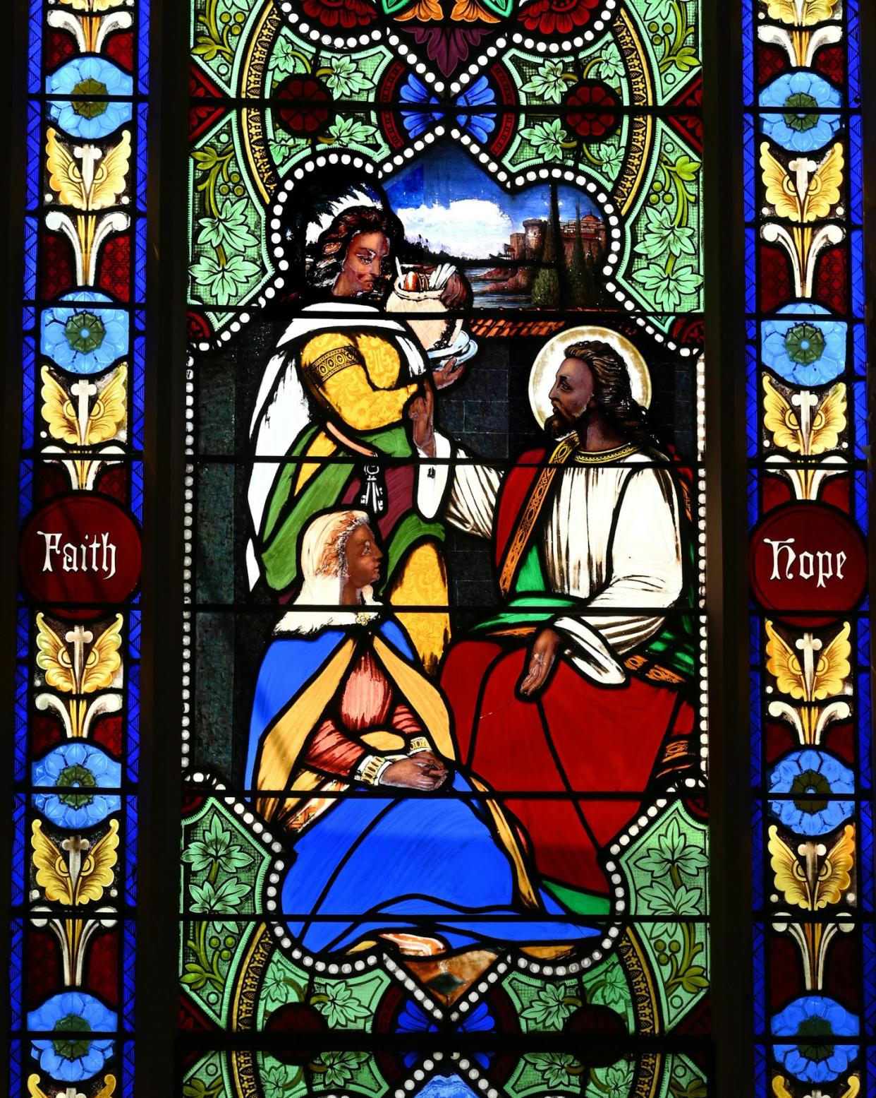 A stained-glass window that was part of a church shows a dark-skinned Jesus, which was unusual at the time. Michel M. Raguin