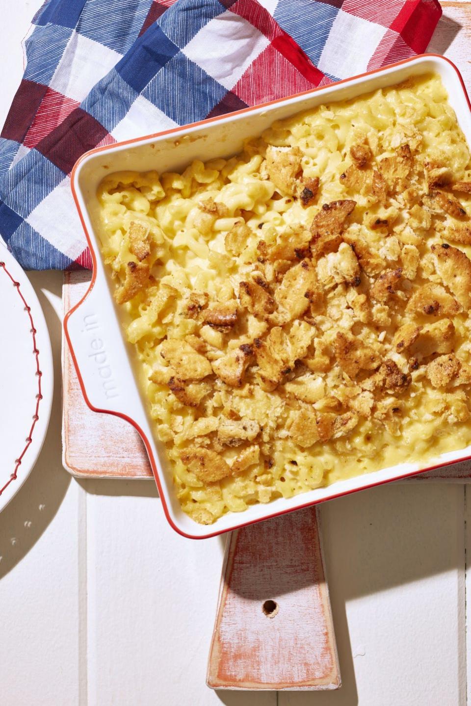 ritzy ranch mac n cheese in a square white baking dish with red trim