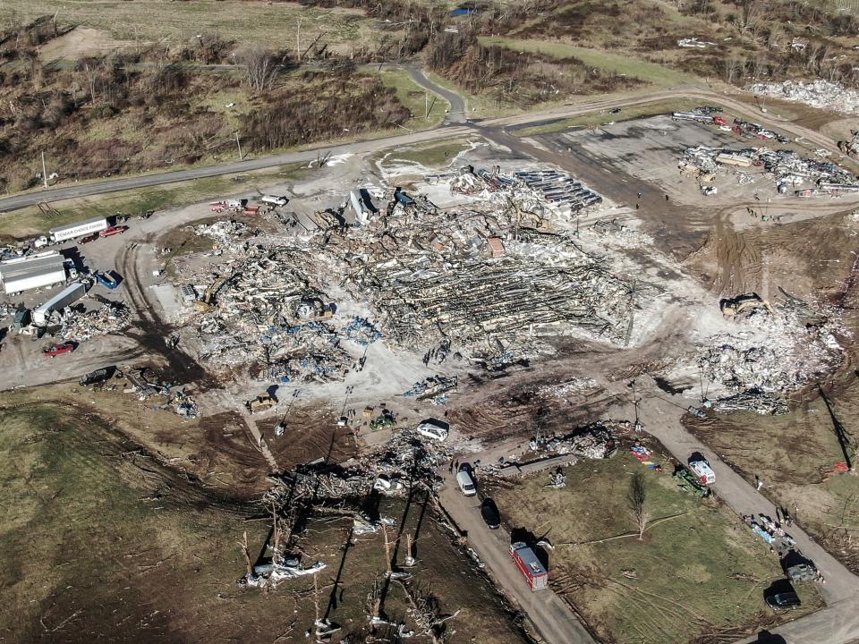 An aerial photo made with a drone shows the destruction of the Mayfield Consumer Products candle factory after tornadoes moved through the area leaving destruction and death across six states, in Mayfield, Kentucky, USA, 12 December 2021 (EPA)