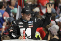 FILE - In this Sunday, Feb. 16, 2020, file photo, Ryan Newman waves before the NASCAR Daytona 500 auto race at Daytona International Speedway in Daytona Beach, Fla. Ryan Newman is fully alert, walking around the hospital and joking with staff two days after his frightening crash on the final lap of the Daytona 500. Roush Fenway Racing said Wednesday, Feb. 19, 2020, the 42-year-old driver “continues to show great improvement.” (AP Photo/Chris O'Meara, File)