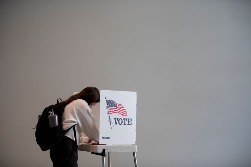 FILE PHOTO: FILE PHOTO: FILE PHOTO: Early voting begins in Michigan