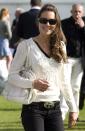 <p>Sporting a v-neck sweater and dark jeans for a charity polo match at Beaufort Polo Club in Gloucestershire.</p>