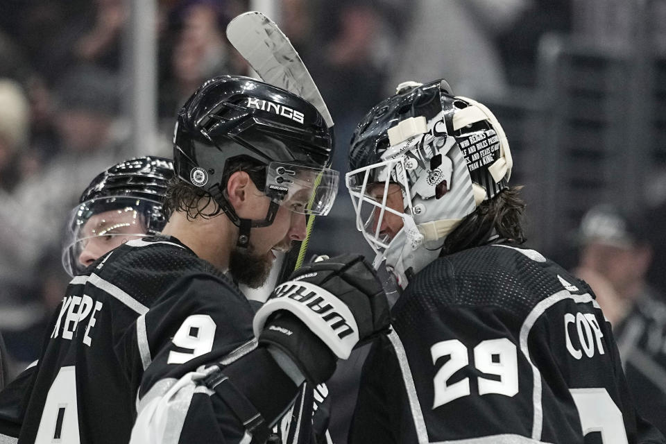 Los Angeles Kings right wing Adrian Kempe, left, and goaltender Pheonix Copley congratulate each other after the Kings defeated the Pittsburgh Penguins 6-0 in an NHL hockey game Saturday, Feb. 11, 2023, in Los Angeles. Kempe had four goals in the shutout. (AP Photo/Mark J. Terrill)