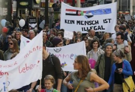 Protesters march during a demonstration in support of refugees in Vienna, Austria, October 3, 2015. REUTERS/Heinz-Peter Bader