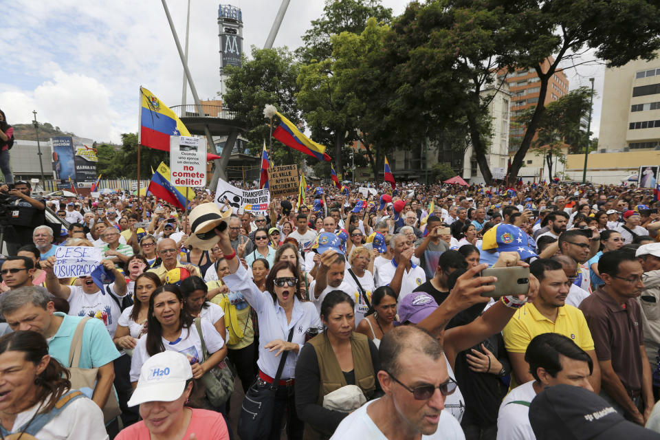 Opponents of Nicolas Maduro's government attend a rally led by opposition leader Juan Guaidó, in Caracas, Venezuela, Saturday, May 11, 2019. Guaidó has called for nationwide marches protesting the Maduro government, demanding new elections and the release of jailed opposition lawmakers. (AP Photo/Fernando Llano)