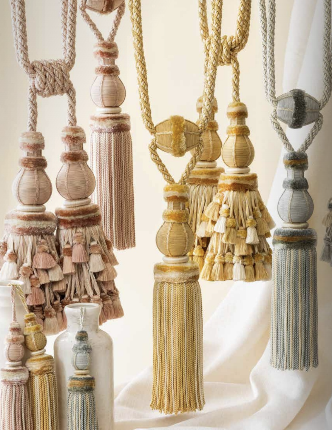 a group of pastel colored tassels