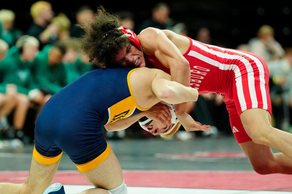 Hayden Holmes (red) of Paulsboro, is shown as he wrestles Lucas Beyers of Delaware Valley. Holmes won the 113 pound match, in Piscataway, Sunday, February 11, 2024.