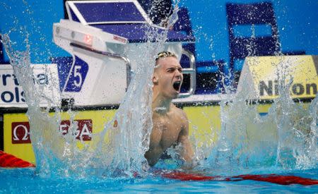 Swimming – 17th FINA World Aquatics Championships – Men's 100m Freestyle Final – Budapest, Hungary – July 27, 2017 – Caeleb Remel Dressel of the U.S. reacts after finishing first. REUTERS/Stefan Wermuth