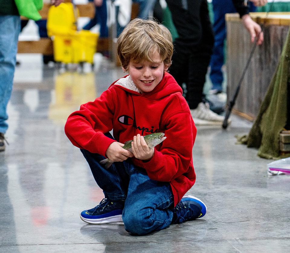 8-year-old Nolan Groll catches a fish in the Trout Pond at the 82nd Milwaukee Journal Sentinel Sports Show in 2023. The 2024 edition of the Sports Show runs this weekend at State Fair Park.