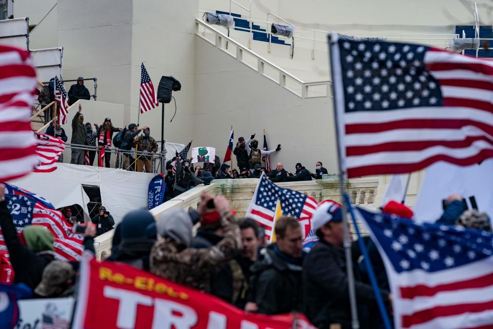 Supporters of US President Donald Trump clash with the US Capitol police during a riot at the US Capitol on January 6, 2021, in Washington, DC. - Donald Trump's supporters stormed a session of Congress held January 6 to certify Joe Biden's election win, triggering unprecedented chaos and violence at the heart of American democracy and accusations the president was attempting a coup. (Photo by ALEX EDELMAN / AFP) (Photo by ALEX EDELMAN/AFP via Getty Images)