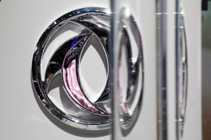 FILE PHOTO: The logo of Dongfeng Motor Corp is seen behind glass door at the Auto China 2016 auto show in Beijing