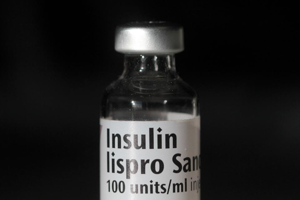 An empty bottle of Insulin lispro by French multinational pharmaceutical company Sanofi is photographed as an arranged illustration in London on February 21, 2019.