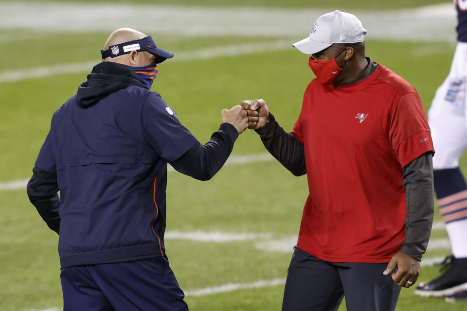 FILE - In this Oct. 8, 2020, file photo, Chicago Bears coach Matt Nagy, left, greets Tampa Bay Buccaneers defensive coordinator Todd Bowles before an NFL football game in Chicago. Bowles has long been regarded as one of the top defensive minds in the game. A Super Bowl champion as a safety in Washington, Bowles has spent the past two decades as a coach in the NFL, including a four-year stint as head coach with the Jets. (AP Photo/Kamil Krzaczynski, File)
