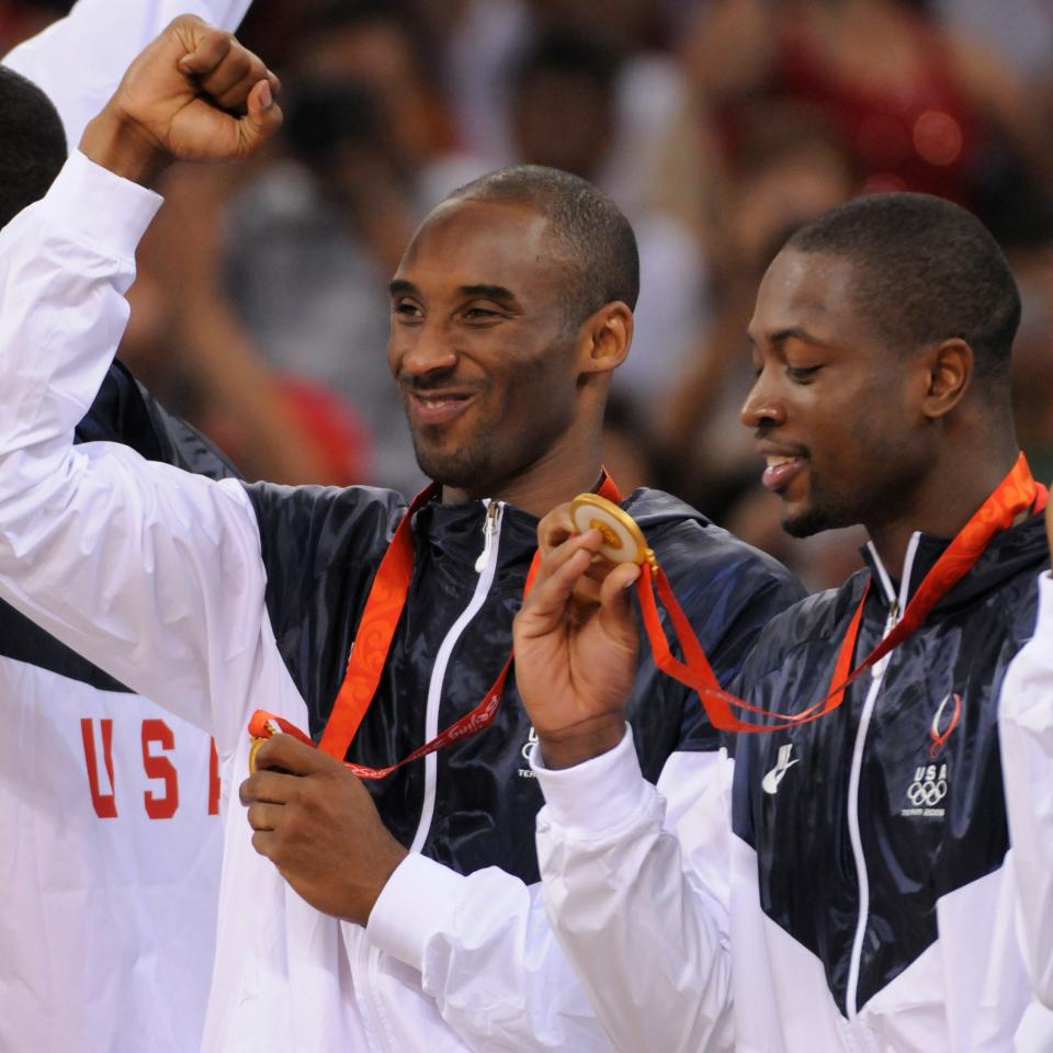 Kobe Bryant pumps his fist and Dwyane Wade looks at his gold medal after the USA beat Spain 118-107 in the men's basketball gold medal game in the 2008 Beijing Olympics.