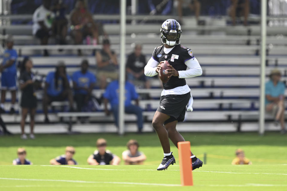 Baltimore Ravens quarterback Lamar Jackson throws during NFL football training camp practice, Wednesday, July 26, 2023, in Owings Mills, Md. (AP Photo/Gail Burton)