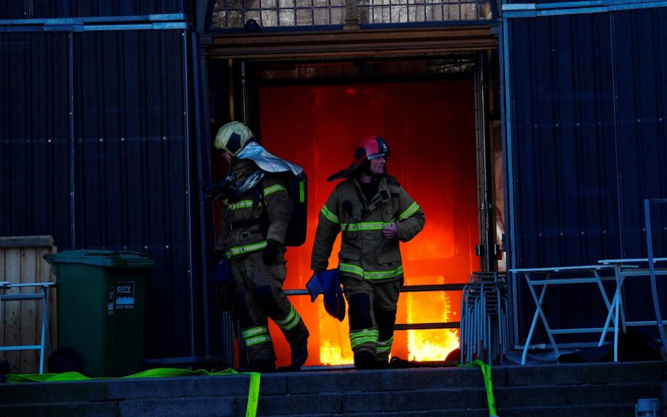 Firefighters work at the scene