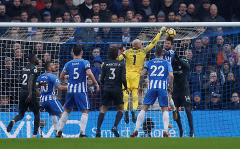 Chelsea's Willy Caballero in action with Brighton's Davy Propper - Credit:  Action Images