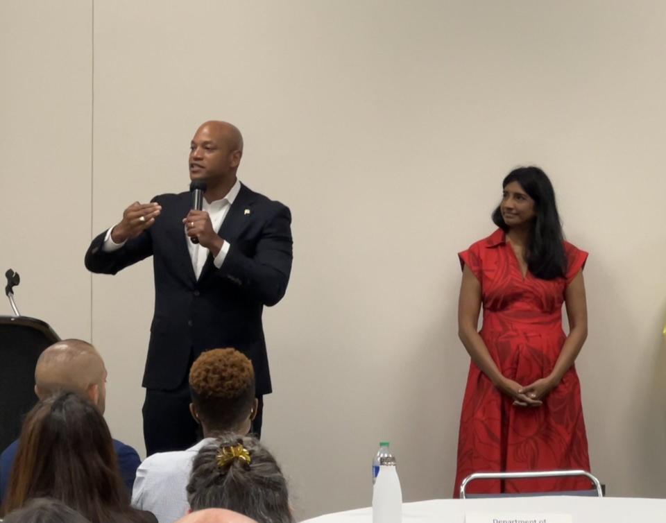 Gov. Wes Moore speaks at the Maryland Municipal League Conference in Ocean City on June 27, 2023 before a meeting of his cabinet secretaries and local elected officials. Lt. Gov. Aruna Miller, at right, looks on. Moore visited the US Wind facility in Sparrows Point on Monday.