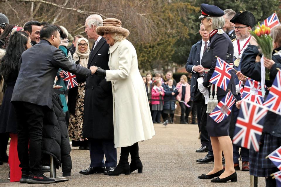 King Charles III and the Queen Consort speak to members of the public as they arrive for a visit to Colchester Castle (PA)