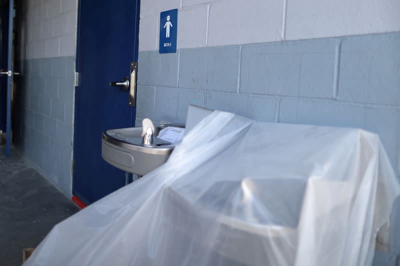 FILE PHOTO: A covered water fountain is seen during summer break renovations and installation of social distancing measures at St. Joseph's School, amid the outbreak of the coronavirus disease (COVID-19), in La Puente, near Los Angeles