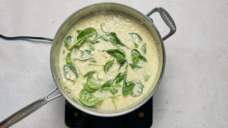 wilting spinach in skillet