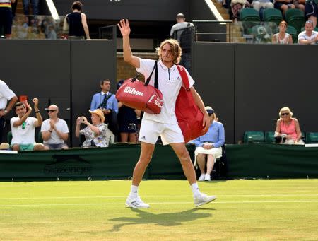 Tennis - Wimbledon - All England Lawn Tennis and Croquet Club, London, Britain - July 9, 2018 Greece's Stefanos Tsitsipas waves after losing the fourth round match against John Isner of the U.S. REUTERS/Tony O'Brien