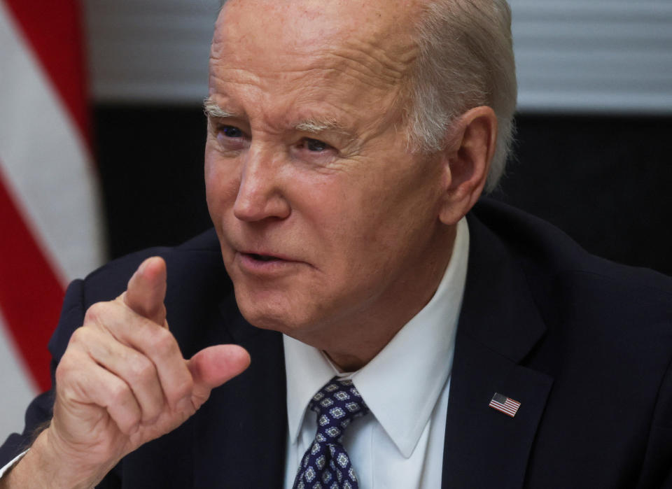  U.S. President Joe Biden speaks with members of his 