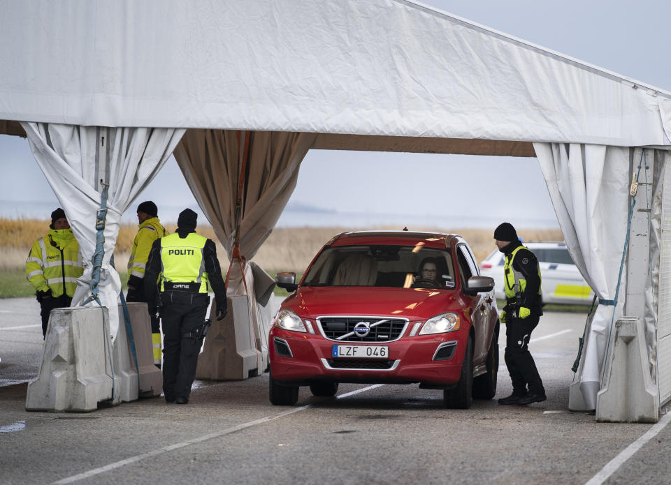 Danish police check travellers from Sweden, near the Highway coming out of the Tunnel near Copenhagen, Denmark, Tuesday Nov. 12, 2019. Danish police have begun to carry out border checks at its crossings with Sweden after a series of shooting crimes and explosions around Copenhagen that Danes say were carried out by perpetrators from the next-door neighbour. (Liselotte Sabroe/Ritzau Scanpix via AP)