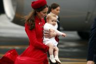 Britain's baby Prince George arrived in New Zealand with parents Prince William and Kate Monday for his first official tour, but the eight-month-old missed the famed Maori welcome after being whisked away indoors amid wild weather.REUTERS/Phil Noble (NEW ZEALAND - Tags: ROYALS ENTERTAINMENT)