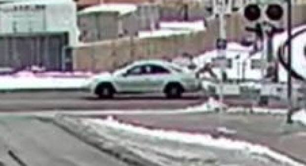 The Calgary Police Service have released CCTV images of a car involved in a hit and run in December that badly injured a male cyclist. The car is believed to be a light-coloured, two-door Honda Accord from the model years 1998 to 2002 and likely had damage to its grille and hood that may have since been repaired. (Calgary Police Service - image credit)