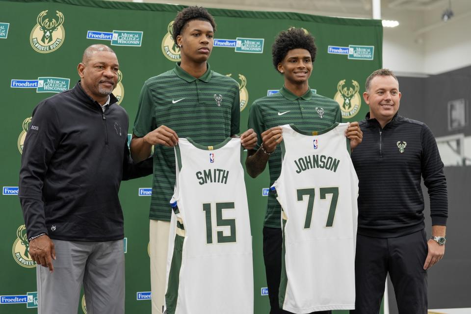 Milwaukee Bucks 2024 draft picks AJ Johnson and Tyler Smith pose for a picture with head coach Doc Rivers and general manager Jon Horst at a news conference Tuesday, July 2, 2024, in Milwaukee. (AP Photo/Morry Gash)