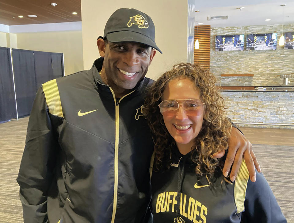 Deion Sanders and Constance Schwartz-Morini pose in Boulder, Colo., Feb. 1, 2023. One of Deion Sanders' most trusted business associates and advisors is Constance Schwartz-Morini. Working behind the scenes, she is the guiding force in his evolution from “Prime Time” to “Coach Prime.”(AP Photo/Pat Graham)