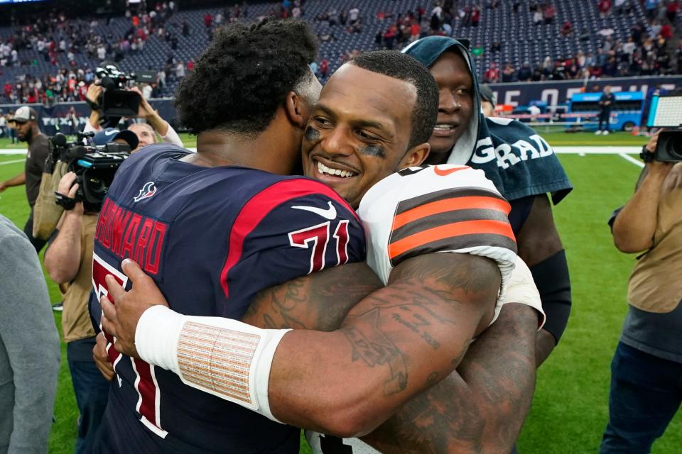 Cleveland Browns quarterback Deshaun Watson is congratulated by Houston Texans offensive tackle Tytus Howard (71) after their NFL football game between the Cleveland Browns and Houston Texans in Houston, Sunday, Dec. 4, 2022. The Browns and Watson go back to Houston for the second consecutive season, this time on Christmas Eve.