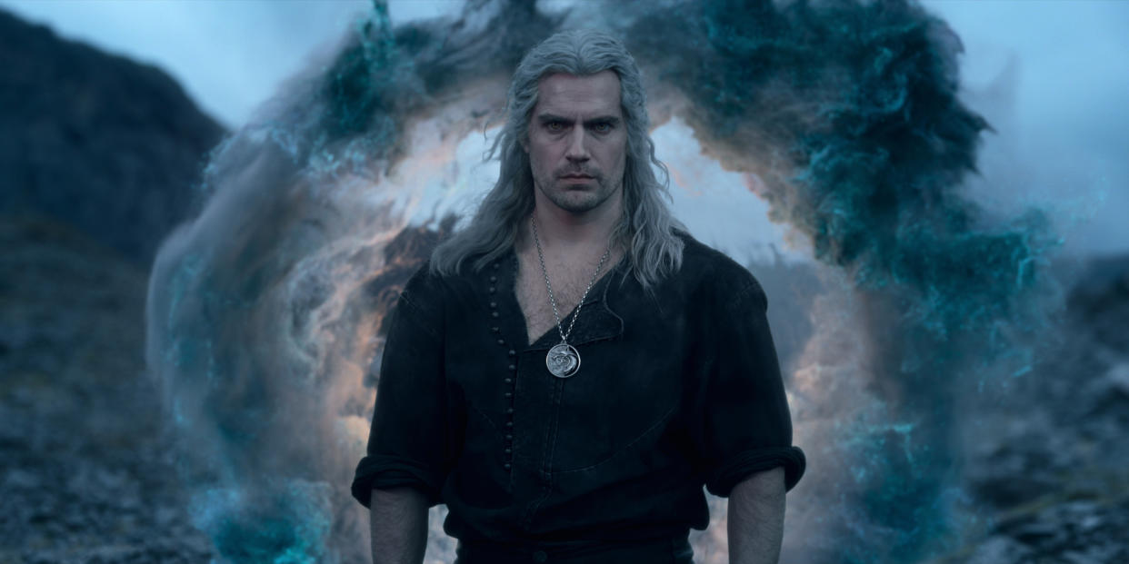  Geralt of Rivia stands in front of a portal 