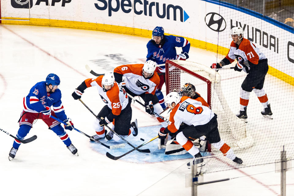 New York Rangers' Alexis Lafreniere (13) scores against the Philadelphia Flyers during the third period of an NHL hockey game Tuesday, March 26, 2024 in New York. (AP Photo/Peter K. Afriyie)