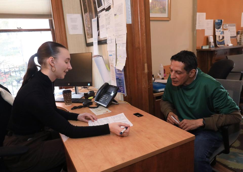 Madison Ahouse, senior case manager for the Poughkeepsie office of Exodus Transitional Community works with a new client, Frank Garcia on December 11, 2023.