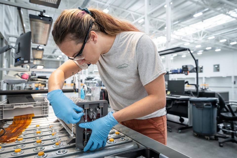 Assembling a battery at Beta Technologies' facility in St. Albans, in the former Energizer Battery plant.