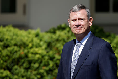 FILE PHOTO: U.S. Supreme Court Chief Justice John Roberts arrives for the swearing in ceremony of Neil Gorsuch as an associate Supreme Court Justice in the Rose Garden of the White House in Washington, U.S., April 10, 2017. REUTERS/Joshua Roberts/File Photo