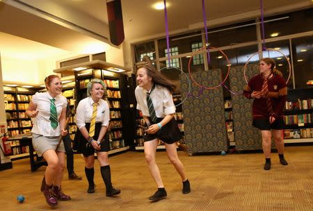 Fans play the fictional game of Qudditch at an event to mark the release of the book of the play of Harry Potter and the Cursed Child parts One and Two at a bookstore in London, Britain July 30, 2016. REUTERS/Neil Hall