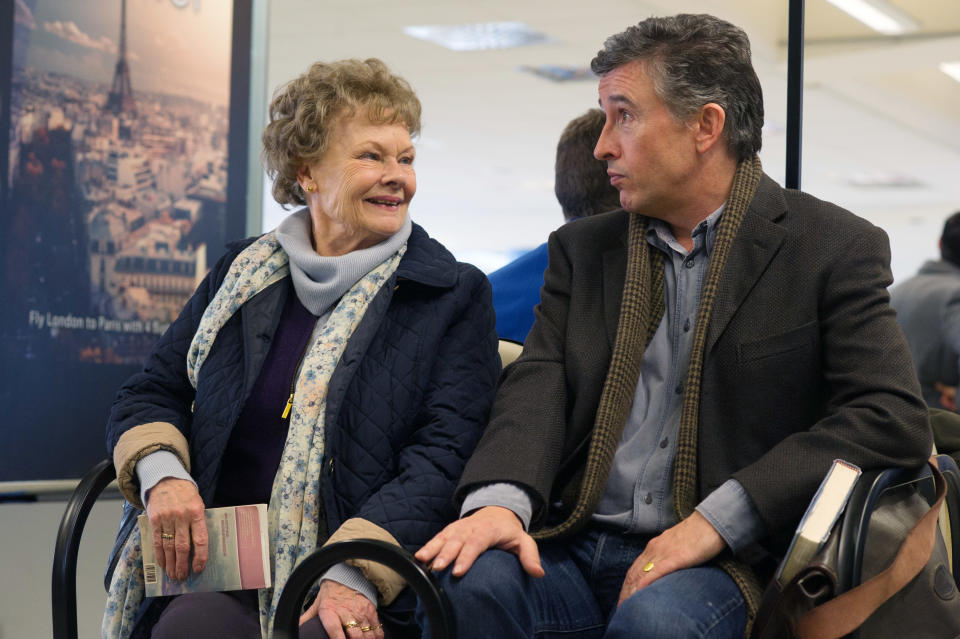 older couple sitting the airport