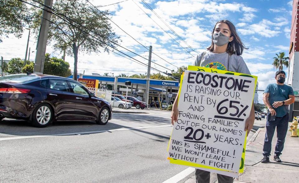 Lizzie Suarez, communications manager at the Miami Workers Center, joins a small group of tenants from Hialeah protesting rent hikes and demanding a negotiation in front of the office of the Eco Stone Group in Miami on Wednesday, Jan. 19, 2022. It is the new landlord of the apartment building at 1501 W 42nd St. in Hialeah. Tenants say their monthly rent is increasing by as much as $650, or 65%.