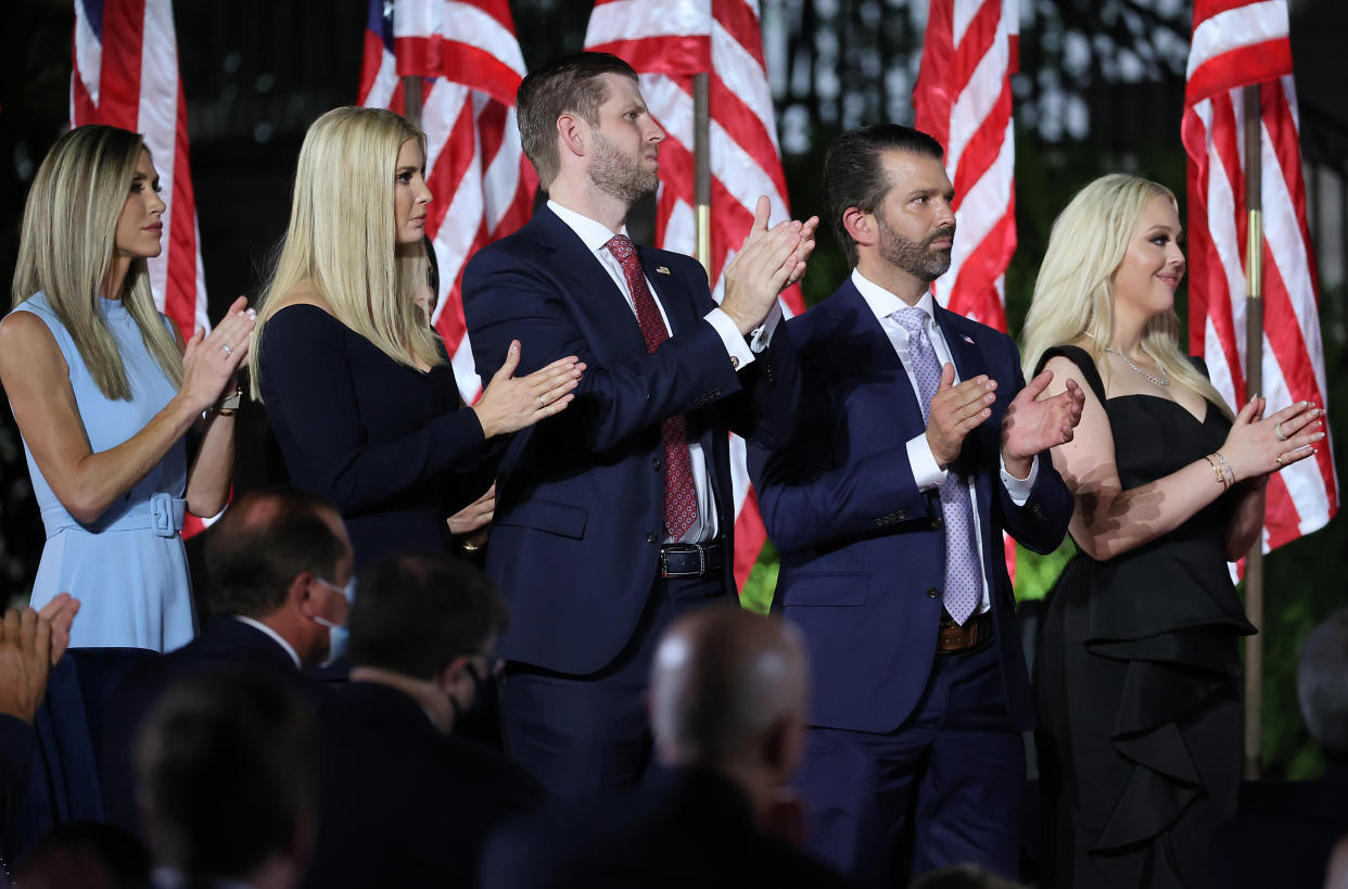 Lara Trump, Ivanka Trump, Eric Trump, Donald Trump Jr. and Tiffany Trump clapping their hands.