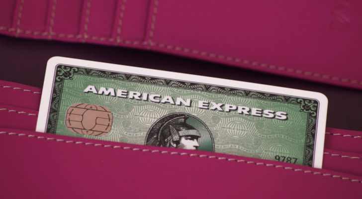 an American Express (AXP) credit card sticking out of someone's pocket